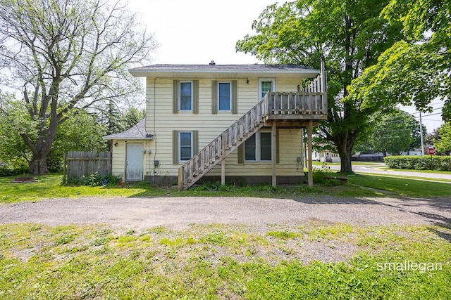 186 N Elm St, Sparta, MI 49345 - view of front of home featuring stairway and a deck