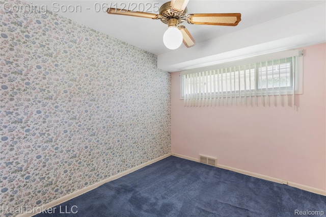 3809 Whittier Ave, Flint, MI 48506 - unfurnished room featuring wallpapered walls, plenty of natural light, a ceiling fan, dark colored carpet, and baseboards