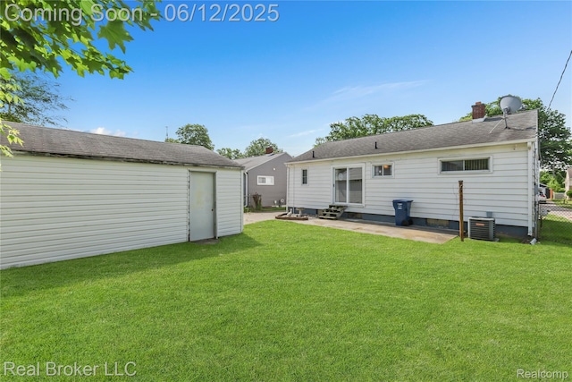 3809 Whittier Ave, Flint, MI 48506 - rear view of house with entry steps, a patio, an outdoor structure, central air condition unit, and a chimney
