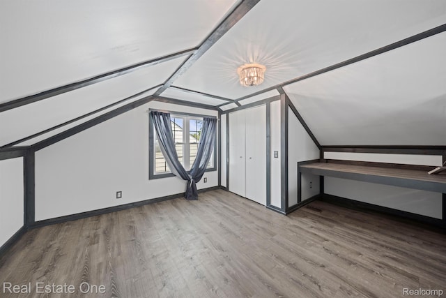 1418 E 10 Mile Rd, Ferndale, MI 48220 - bonus room featuring wood finished floors, vaulted ceiling, and baseboards