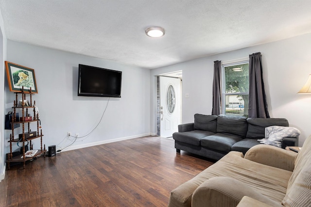 59 Wright St, Coldwater, MI 49036 - living area with wood finished floors, baseboards, and a textured ceiling