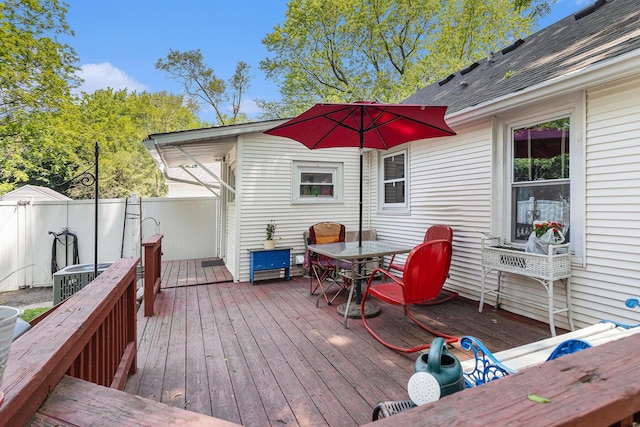 59 Wright St, Coldwater, MI 49036 - wooden terrace featuring outdoor dining area and central AC unit
