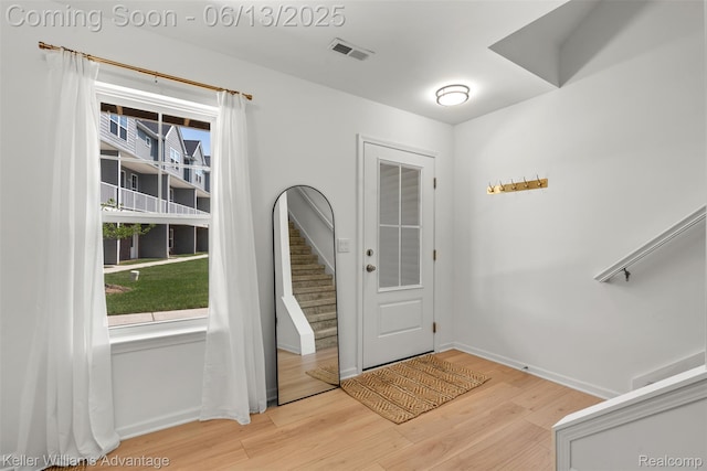 3947 Trailwaycommons Cir, Auburn Hills, MI 48326 - entryway featuring healthy amount of natural light, wood finished floors, and stairs