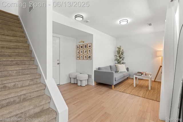 3947 Trailwaycommons Cir, Auburn Hills, MI 48326 - sitting room with stairway and wood finished floors
