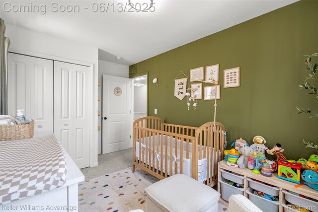 3947 Trailwaycommons Cir, Auburn Hills, MI 48326 - bedroom with a closet, light colored carpet, and a nursery area