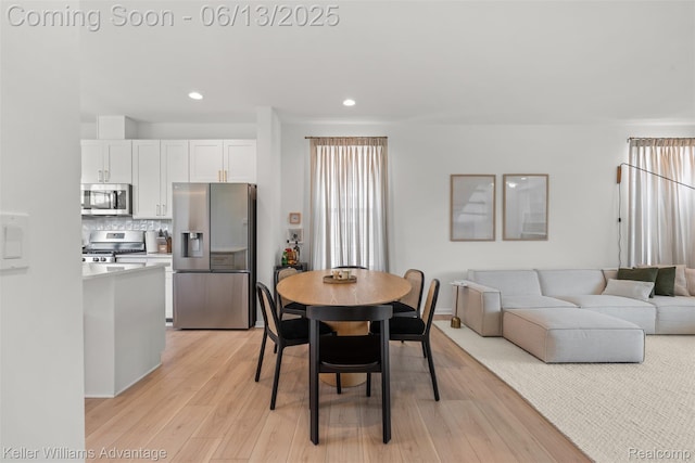 3947 Trailwaycommons Cir, Auburn Hills, MI 48326 - dining area featuring light wood finished floors, recessed lighting, and plenty of natural light
