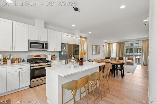 3947 Trailwaycommons Cir, Auburn Hills, MI 48326 - kitchen with appliances with stainless steel finishes, white cabinetry, light countertops, and recessed lighting