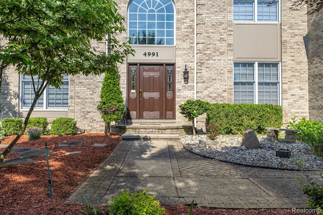 4991 Knollcrest Ct, Commerce Twp, MI 48382 - property entrance featuring brick siding