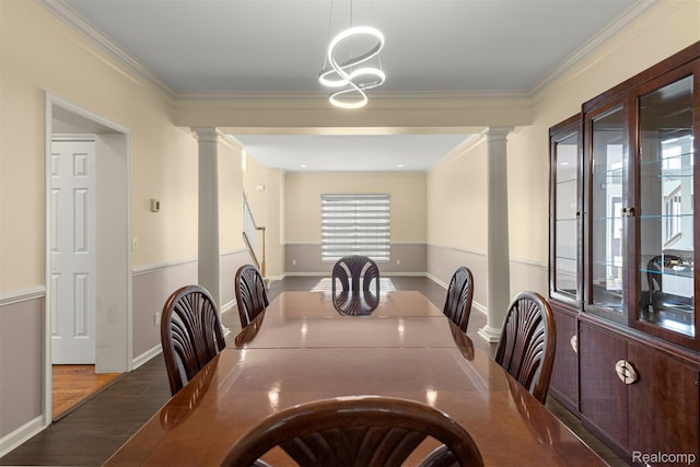 4991 Knollcrest Ct, Commerce Twp, MI 48382 - dining space featuring decorative columns, ornamental molding, a chandelier, and wood finished floors