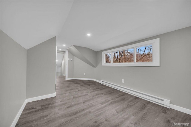 15907 Blackstone St, Detroit, MI 48223 - additional living space with a baseboard heating unit, baseboards, wood finished floors, vaulted ceiling, and recessed lighting