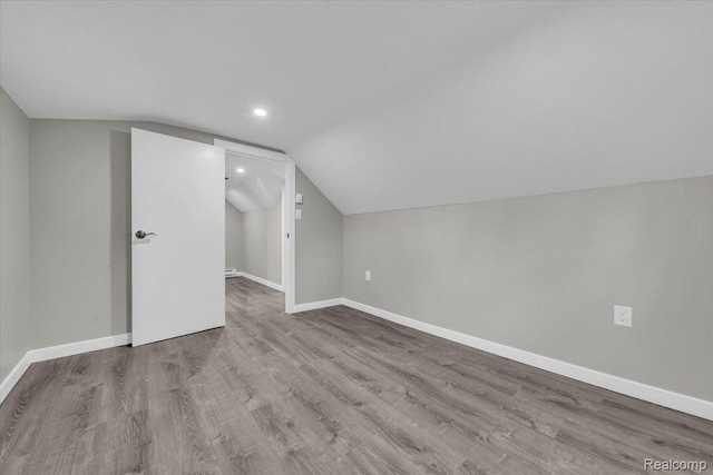 15907 Blackstone St, Detroit, MI 48223 - additional living space featuring lofted ceiling, baseboards, wood finished floors, and recessed lighting