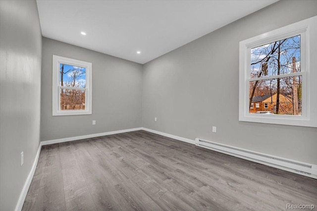 15907 Blackstone St, Detroit, MI 48223 - spare room featuring a baseboard radiator, wood finished floors, baseboards, and recessed lighting