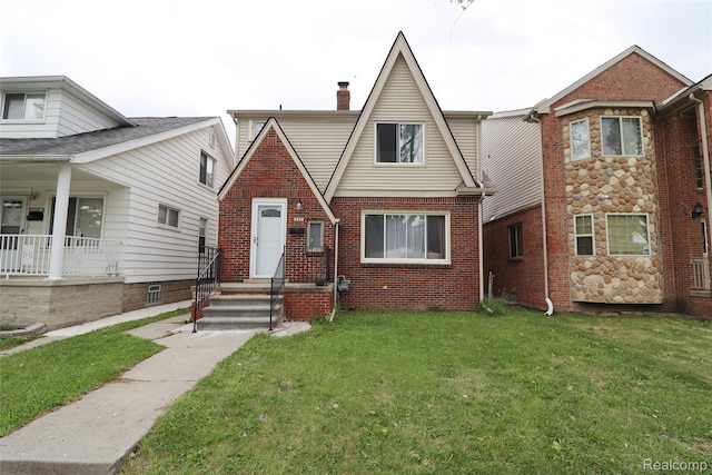 7524 Williamson St, Dearborn, MI 48126 - view of front of property featuring a front lawn, brick siding, and a chimney