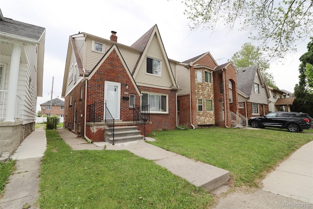 7524 Williamson St, Dearborn, MI 48126 - view of front of property featuring brick siding, a front lawn, and a chimney