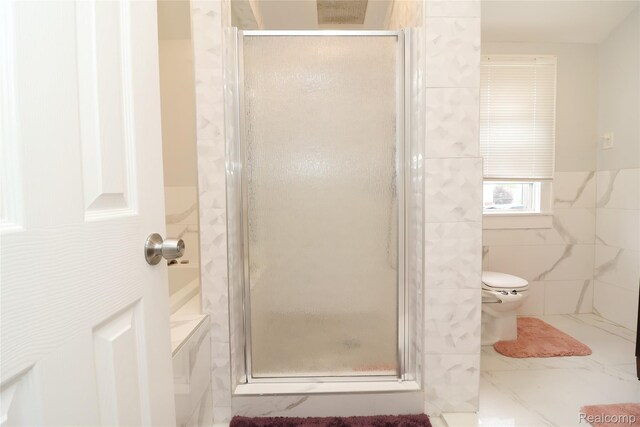 7524 Williamson St, Dearborn, MI 48126 - bathroom with tile walls, a shower stall, and wainscoting
