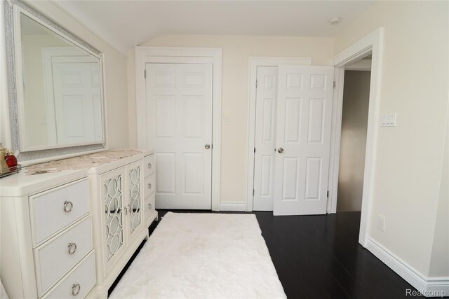 7524 Williamson St, Dearborn, MI 48126 - hallway with baseboards and dark wood-type flooring