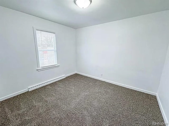 2454 Bellevue St, Saginaw, MI 48601 - spare room with baseboard heating, dark carpet, and baseboards