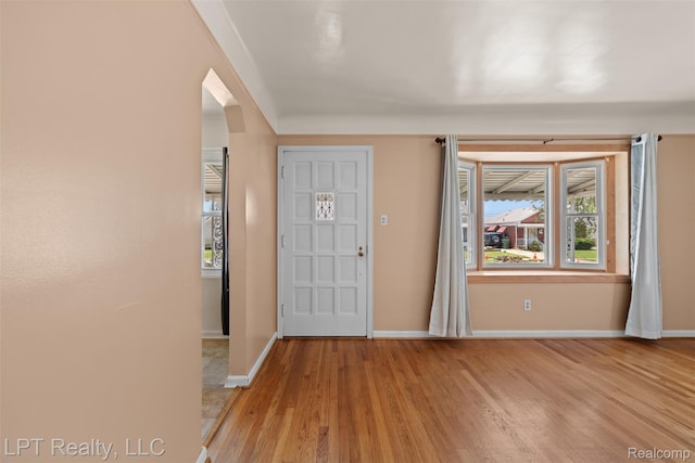 13522 Callender St, Southgate, MI 48195 - foyer entrance with light wood-style flooring and arched walkways