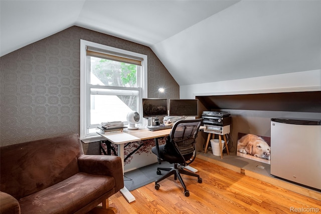 23069 Violet St, Farmington, MI 48336 - office area with wood finished floors, wallpapered walls, and vaulted ceiling