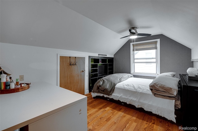 23069 Violet St, Farmington, MI 48336 - bedroom with light wood-type flooring, vaulted ceiling, and ceiling fan