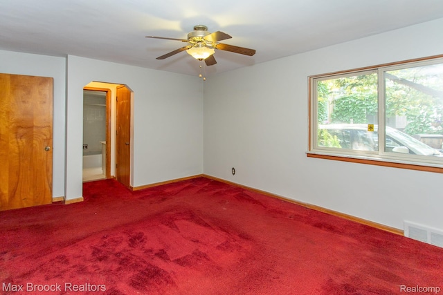 25695 York Rd, Royal Oak, MI 48067 - spare room with arched walkways, ceiling fan, and carpet flooring