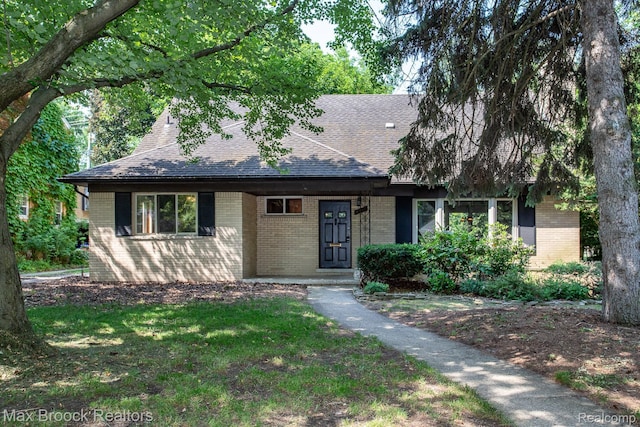 25695 York Rd, Royal Oak, MI 48067 - view of front facade with a shingled roof and brick siding