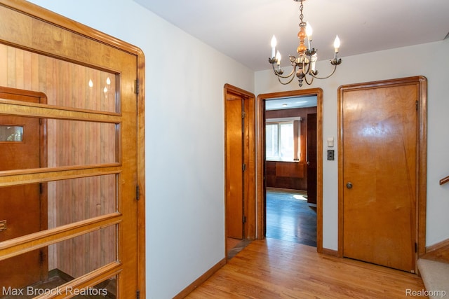 25695 York Rd, Royal Oak, MI 48067 - corridor with light wood finished floors and a chandelier