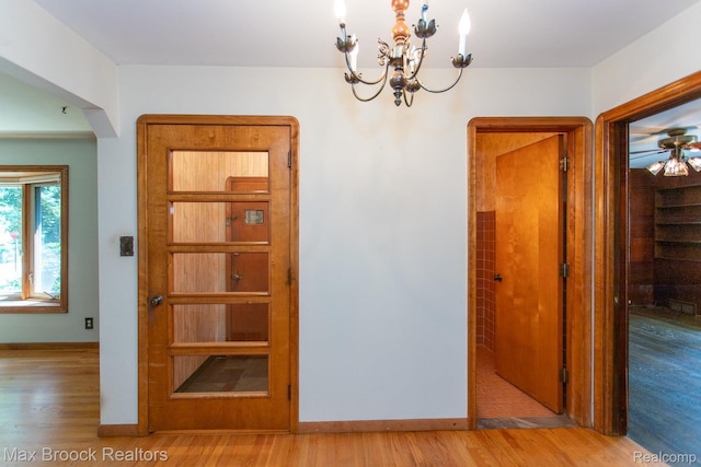 25695 York Rd, Royal Oak, MI 48067 - unfurnished dining area featuring light wood-style flooring and a chandelier