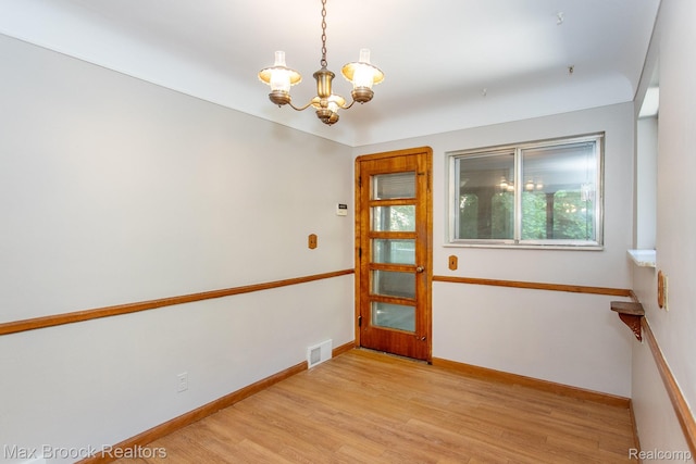 25695 York Rd, Royal Oak, MI 48067 - spare room with a chandelier and light wood-style floors