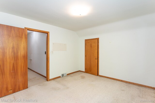 25695 York Rd, Royal Oak, MI 48067 - unfurnished room featuring light carpet and lofted ceiling