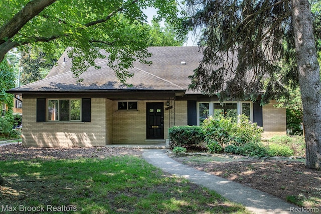 25695 York Rd, Royal Oak, MI 48067 - view of front of house with brick siding, roof with shingles, and a front yard
