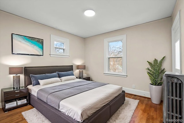 16525 Roselawn St, Detroit, MI 48221 - bedroom featuring multiple windows, baseboards, and wood finished floors