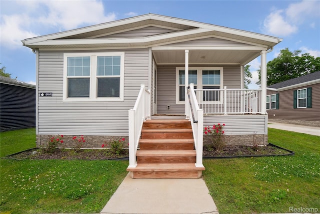 6464 Prince, Fenton, MI 48430 - view of front of home with covered porch and a front yard