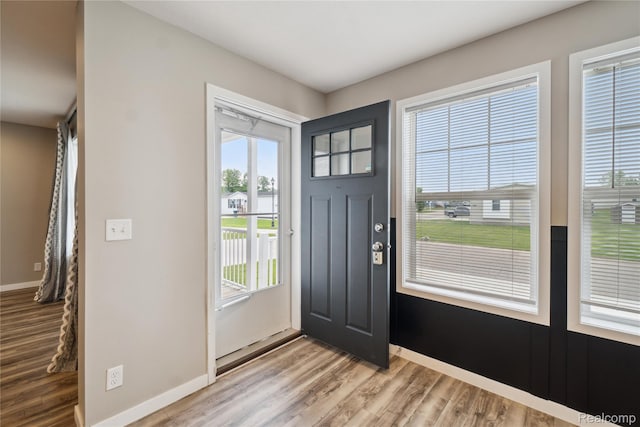6464 Prince, Fenton, MI 48430 - entryway with light wood-style floors, plenty of natural light, and baseboards
