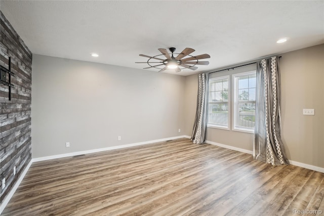6464 Prince, Fenton, MI 48430 - unfurnished room with a ceiling fan, wood finished floors, recessed lighting, and baseboards
