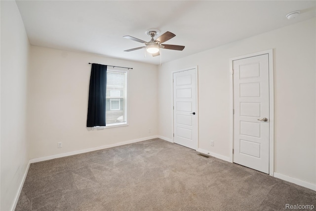 6464 Prince, Fenton, MI 48430 - unfurnished bedroom with carpet, baseboards, and a ceiling fan