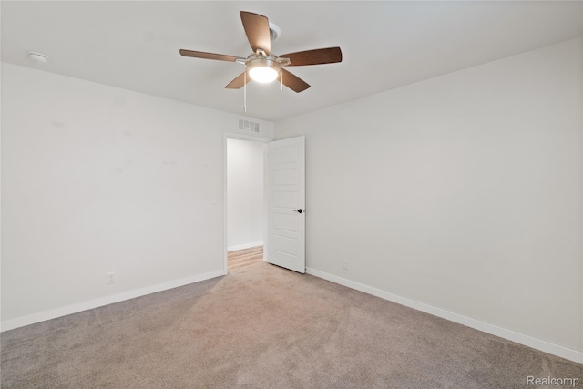 6464 Prince, Fenton, MI 48430 - spare room with a ceiling fan, light carpet, baseboards, and a smoke detector