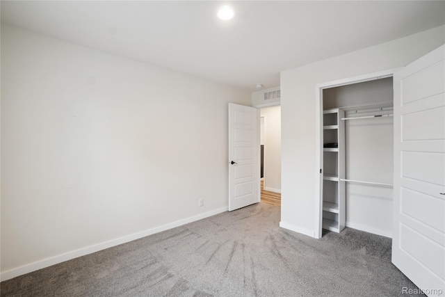 6464 Prince, Fenton, MI 48430 - unfurnished bedroom featuring carpet, baseboards, and a closet