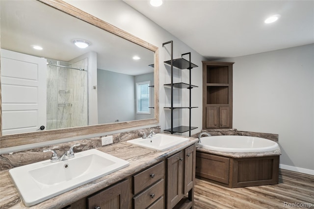 6464 Prince, Fenton, MI 48430 - full bathroom featuring a garden tub, tiled shower, double vanity, wood finished floors, and recessed lighting