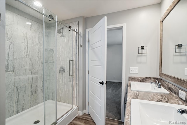 6464 Prince, Fenton, MI 48430 - full bath featuring a shower stall, double vanity, wood finished floors, and baseboards