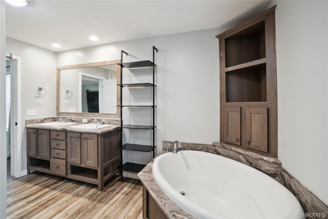 6464 Prince, Fenton, MI 48430 - full bathroom with a bath, double vanity, wood finished floors, and recessed lighting