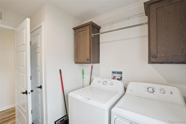 6464 Prince, Fenton, MI 48430 - laundry area featuring cabinet space, washer and clothes dryer, light wood-style floors, and baseboards