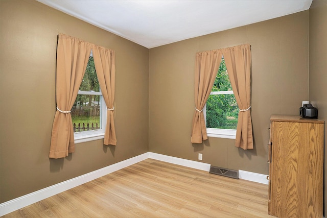 1370 Langeland Ave, Muskegon, MI 49442 - spare room with wood finished floors and baseboards