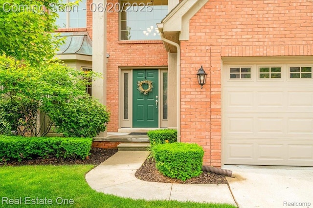 43543 Abbey Cir, Canton, MI 48187 - doorway to property with an attached garage and brick siding