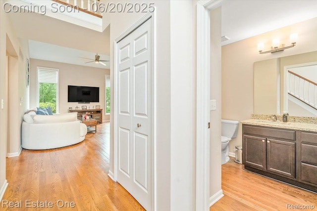 43543 Abbey Cir, Canton, MI 48187 - hallway featuring light wood-style flooring and stairs