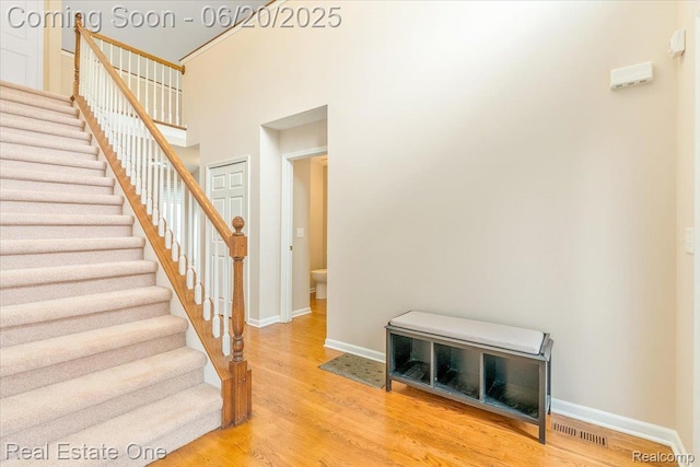 43543 Abbey Cir, Canton, MI 48187 - stairs with wood finished floors and a high ceiling
