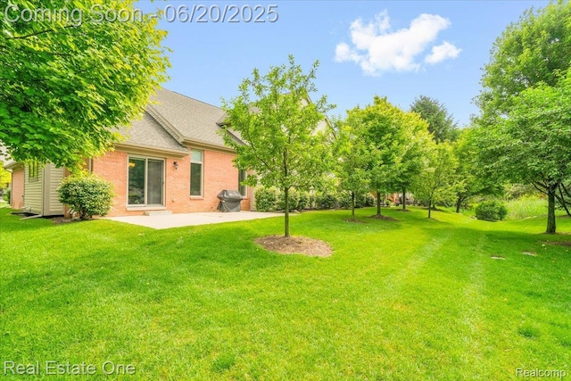 43543 Abbey Cir, Canton, MI 48187 - view of grassy yard with a patio