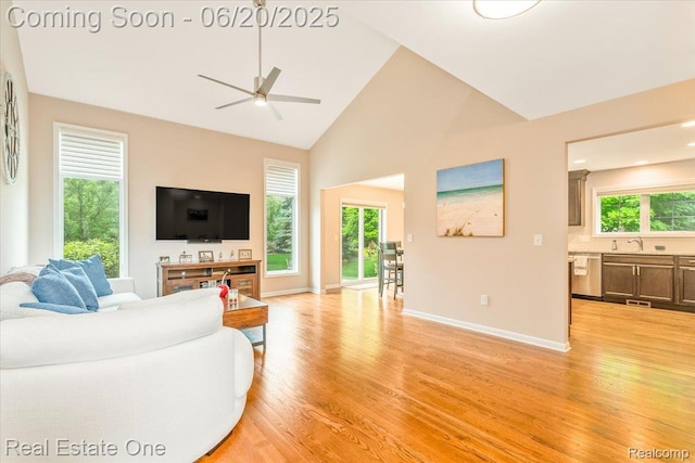 43543 Abbey Cir, Canton, MI 48187 - living area featuring a ceiling fan, light wood-style flooring, and high vaulted ceiling