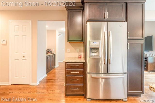 43543 Abbey Cir, Canton, MI 48187 - kitchen featuring stainless steel fridge with ice dispenser, light wood-style floors, light stone counters, and dark brown cabinets