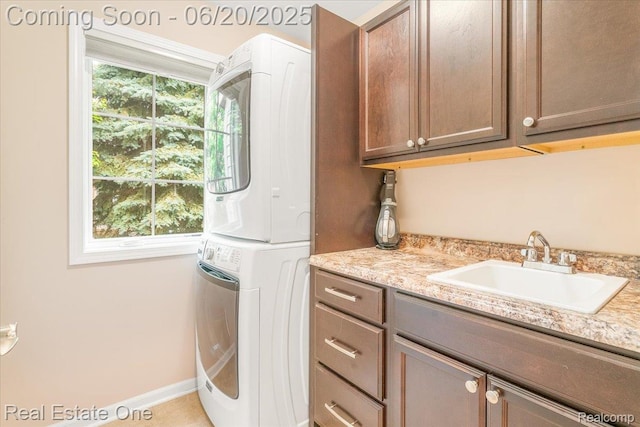 43543 Abbey Cir, Canton, MI 48187 - laundry room featuring stacked washer and clothes dryer and cabinet space
